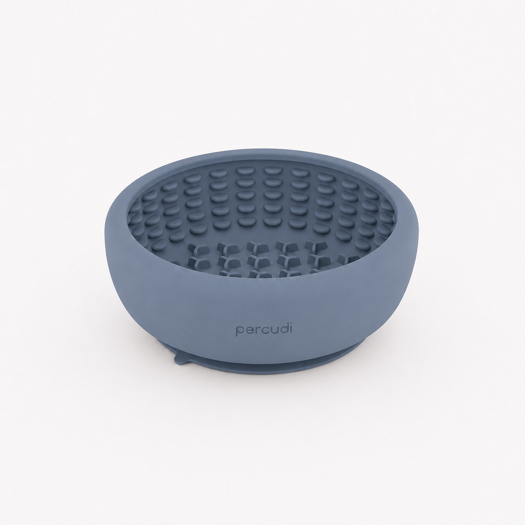 Dog eating from a silicone slow feeder bowl with suction base
