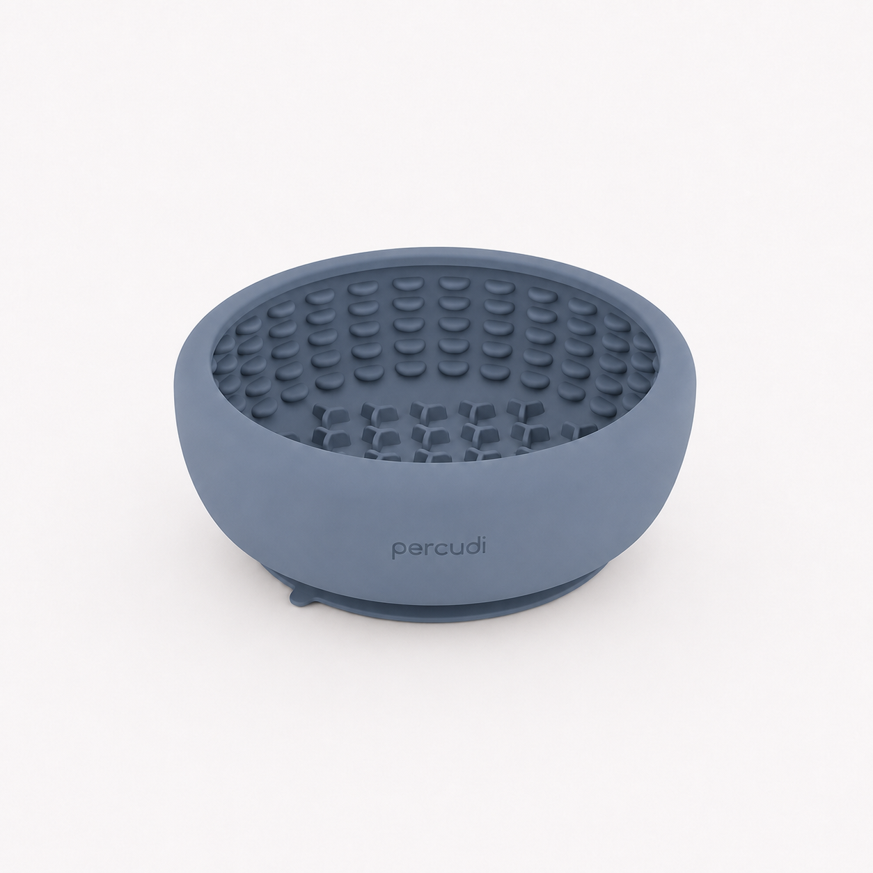 Dog eating from a silicone slow feeder bowl with suction base