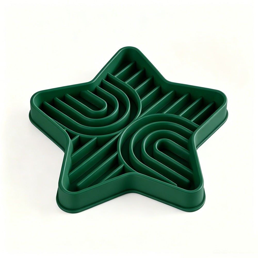 Pet eating from a star-shaped silicone slow feeder mat
