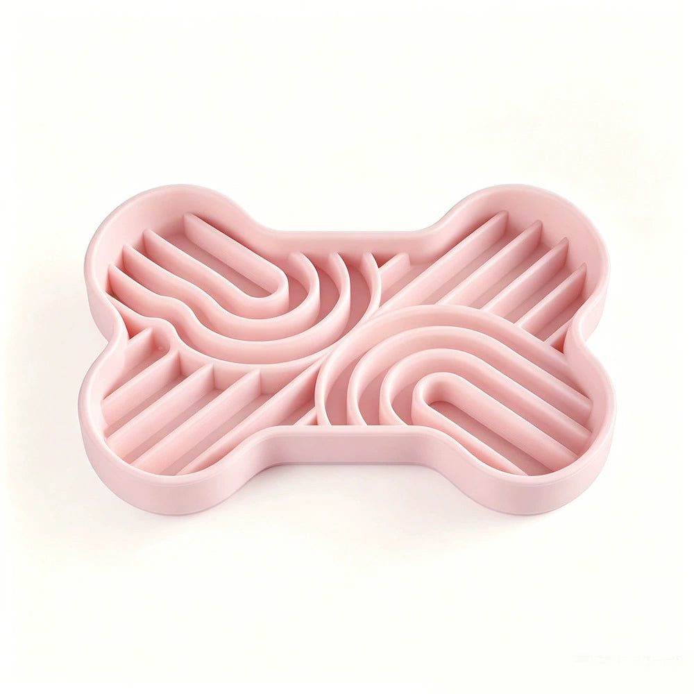 Pink bone-shaped silicone slow feeder bowl with multi-zone maze patterns