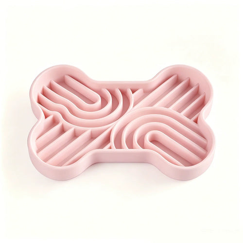 Pink bone-shaped silicone slow feeder bowl with multi-zone maze patterns