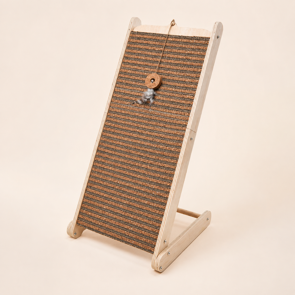 Inclined cork cat scratcher with a natural plywood frame and hanging teaser