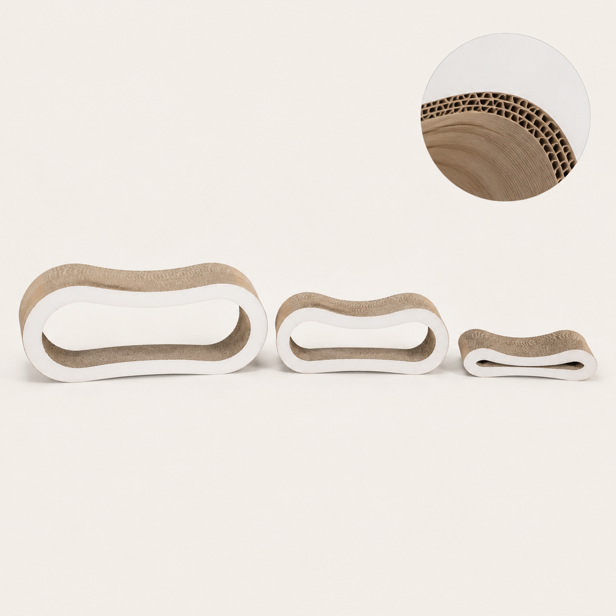 Three separated corrugated cat tunnel pieces with layered cardboard detail