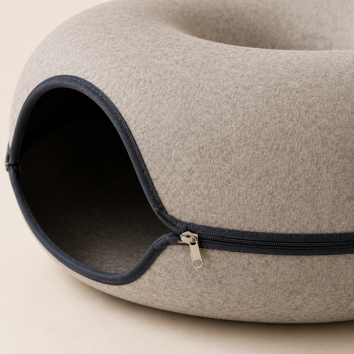 Close-up of molded felt texture, entrance binding and zip-around closure