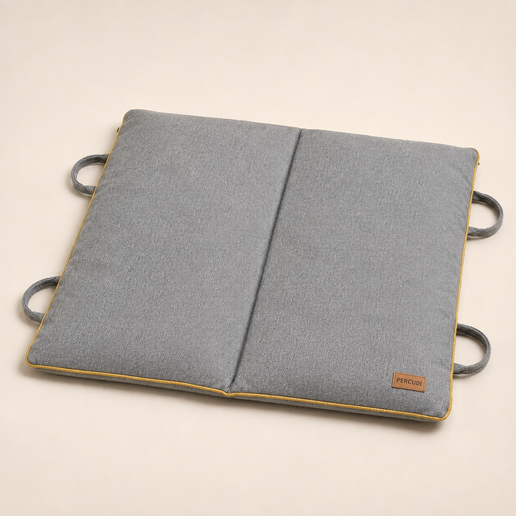Gray foldable pet mat with mustard piping and integrated carry handles