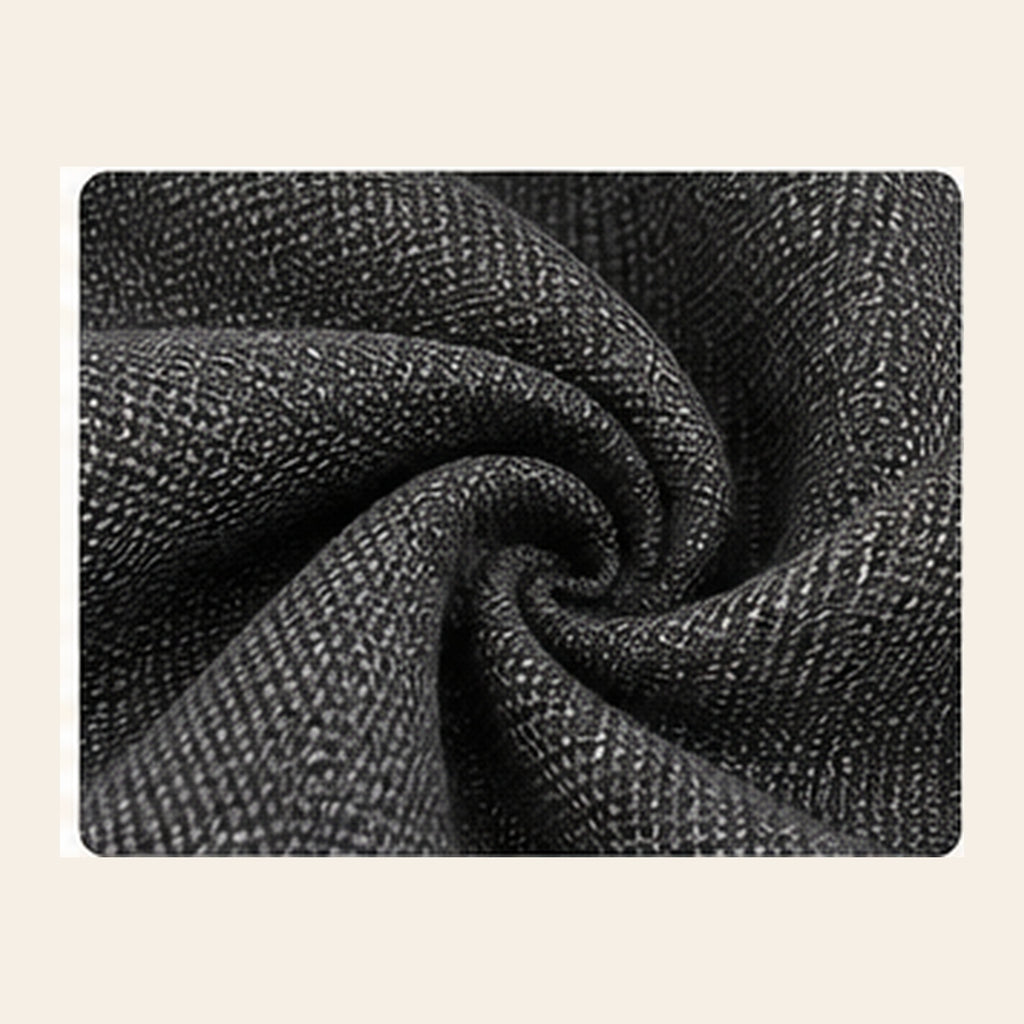Close-up of charcoal gray scratch-resistant upholstery fabric for pet car seat