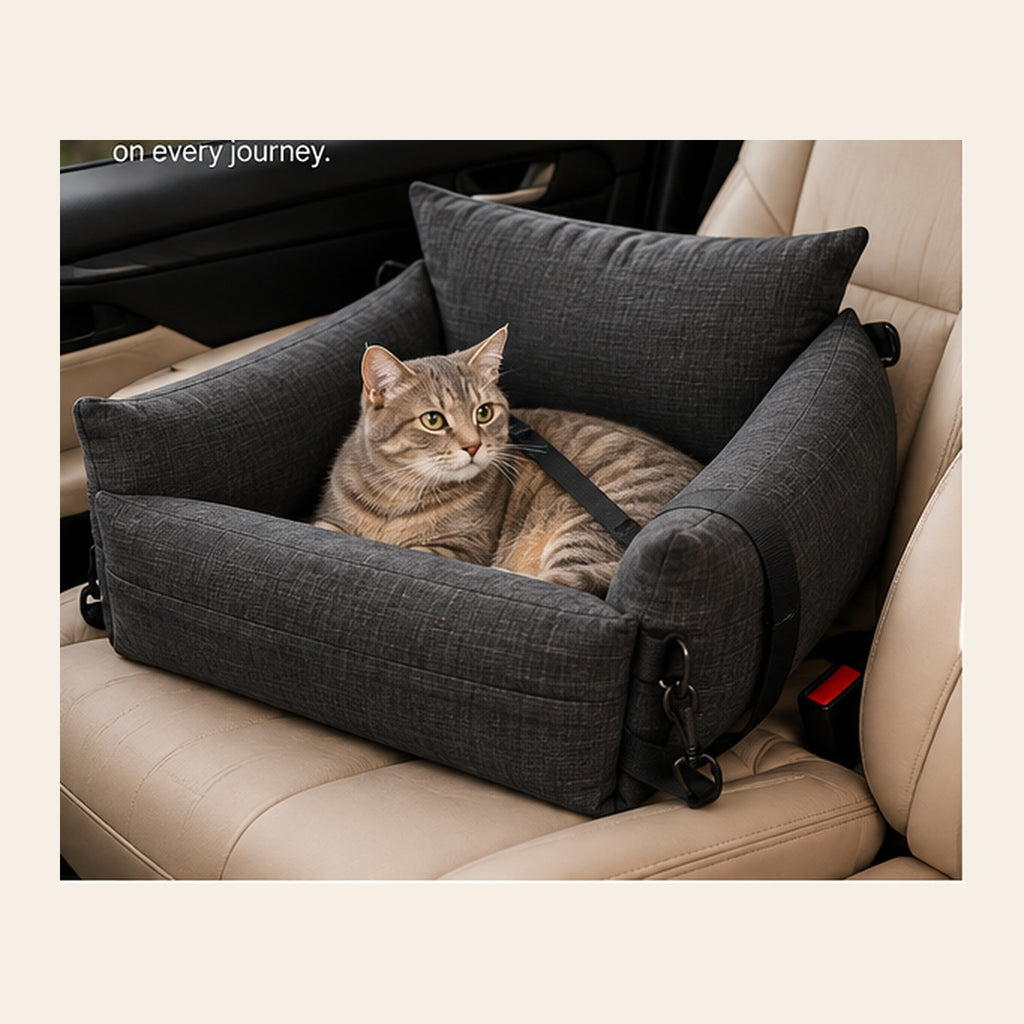 Cat resting in a charcoal gray pet car seat during travel