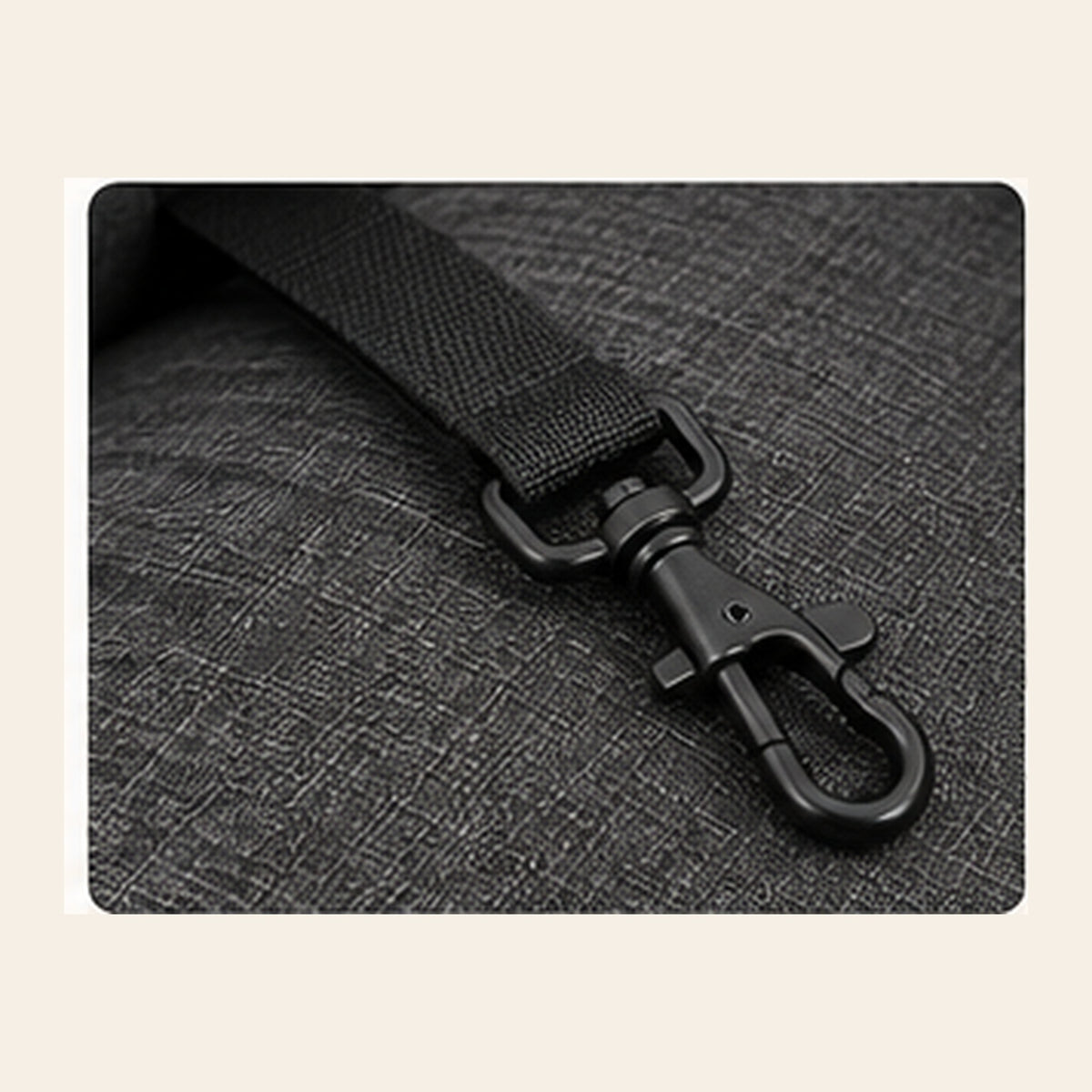 Close-up of integrated safety leash and clip inside charcoal gray pet car seat