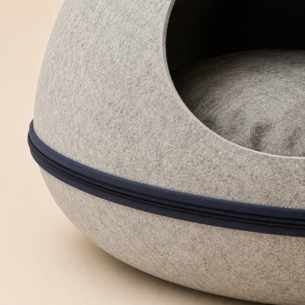 Close-up of the molded gray felt surface and dark zip-around closure