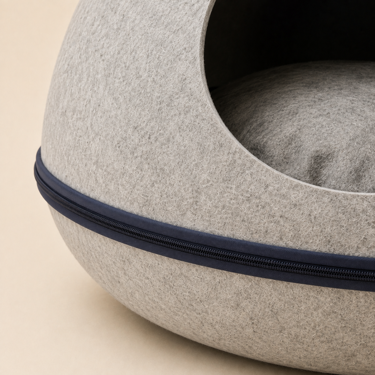 Close-up of the molded gray felt surface and dark zip-around closure