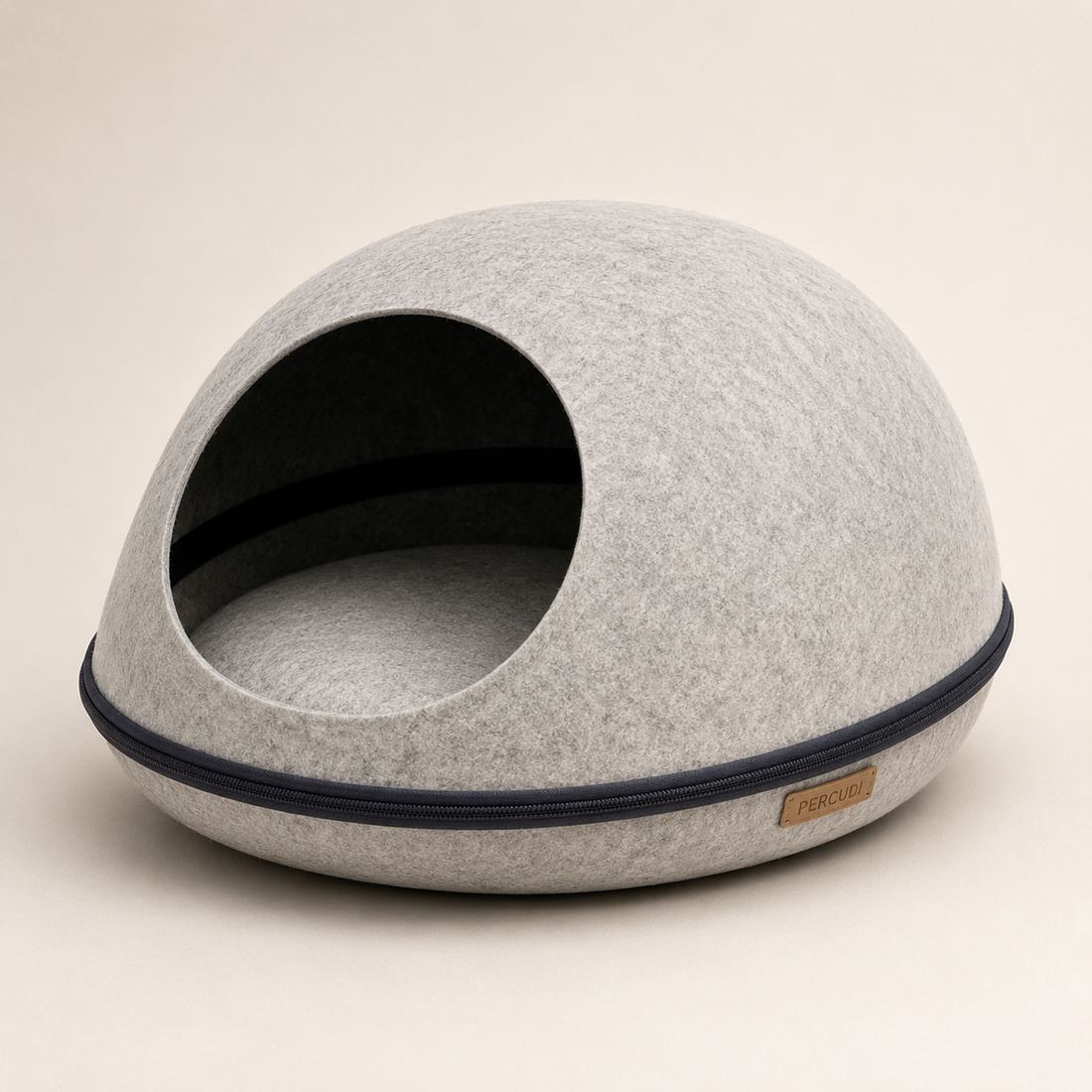 Light gray molded felt egg-shaped cat cave with a cat resting inside