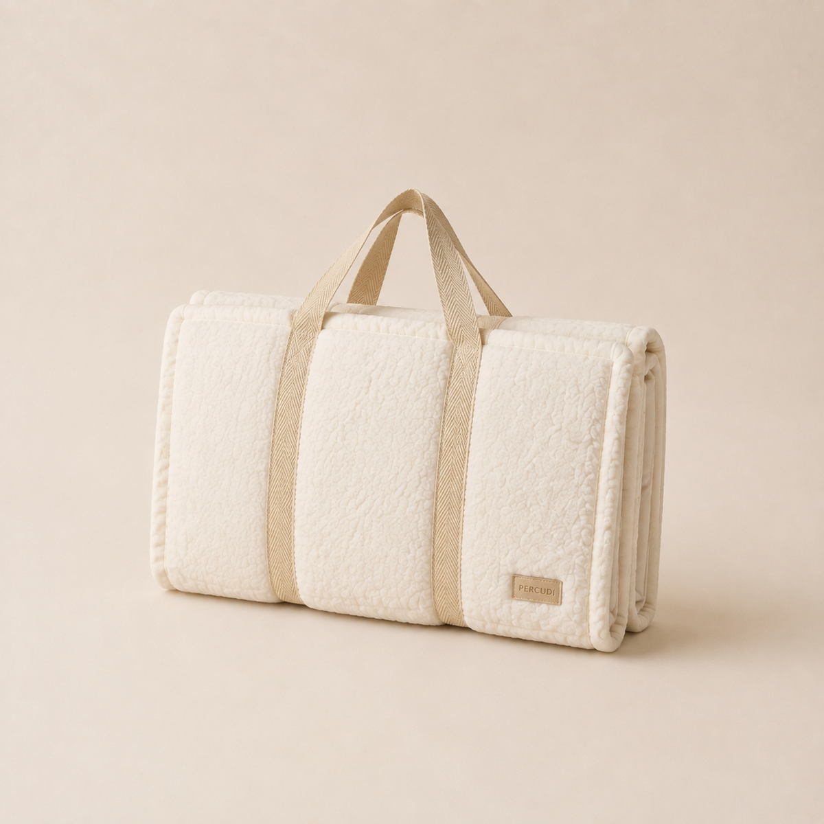 Folded ivory sherpa pet mat with webbing carrying handles