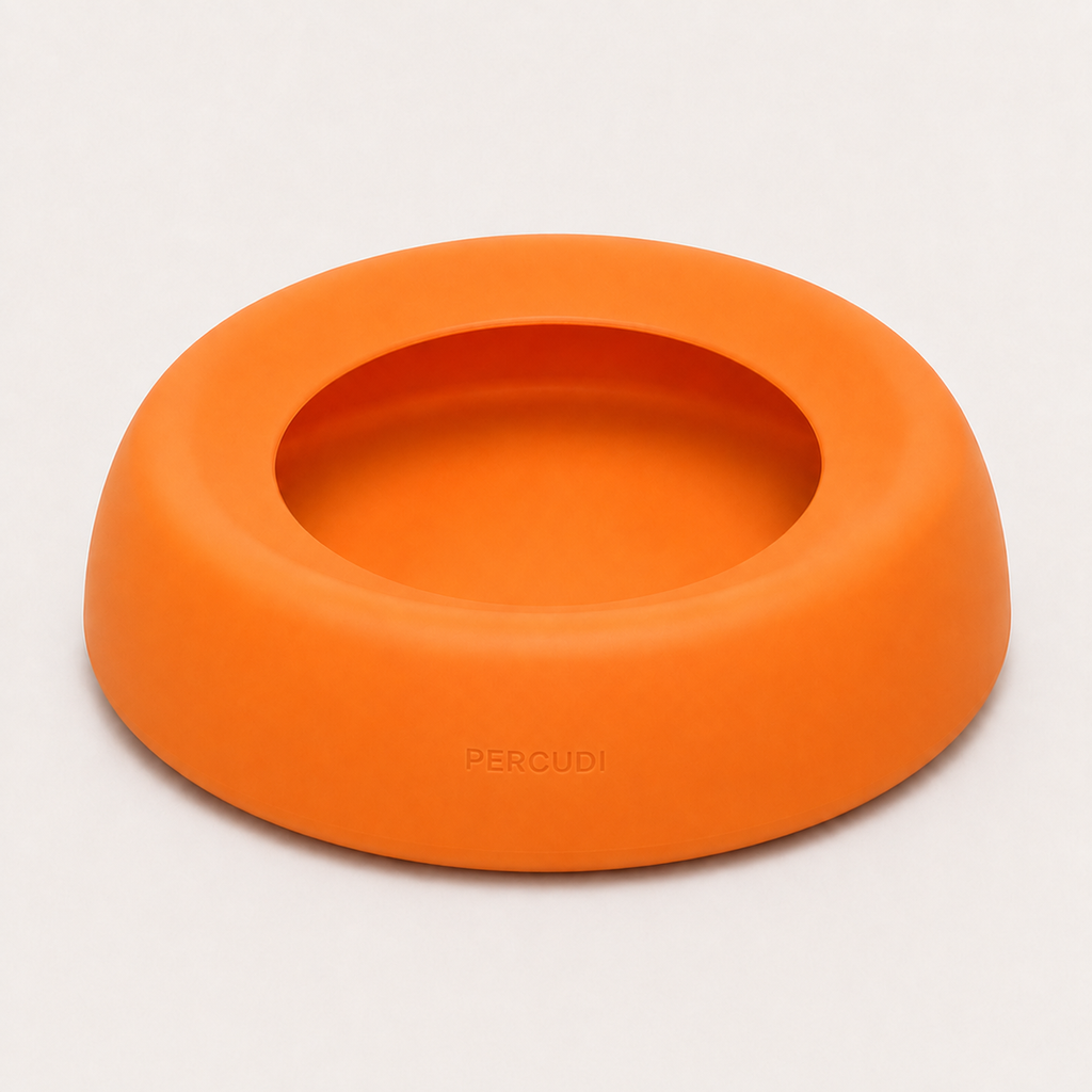 Orange spill-resistant silicone travel water bowl for dogs